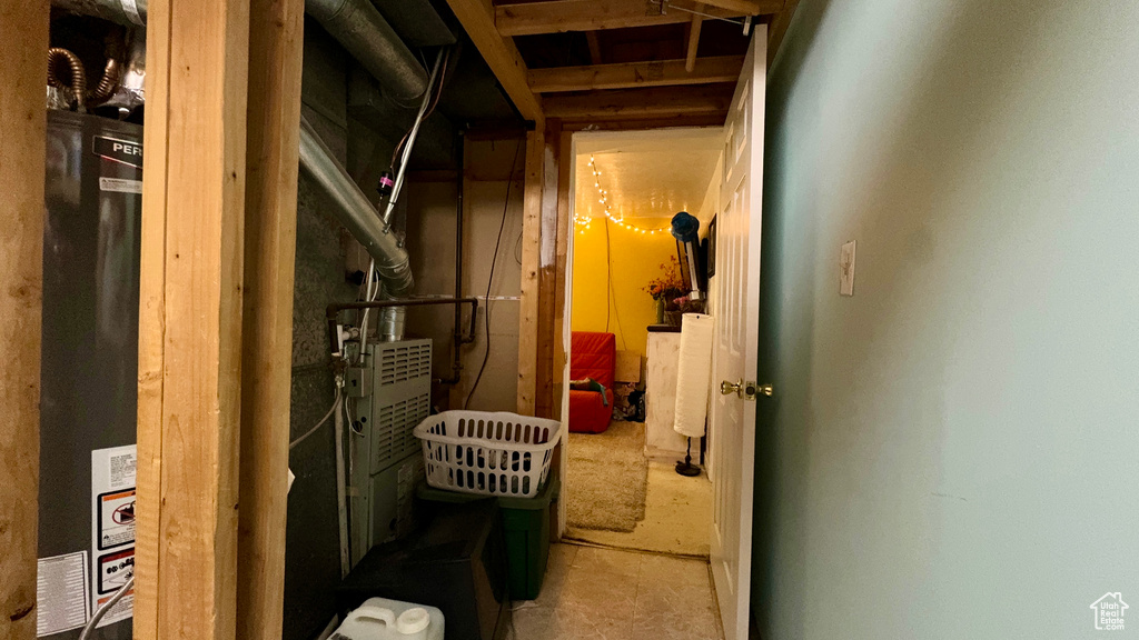 Storage area featuring gas water heater