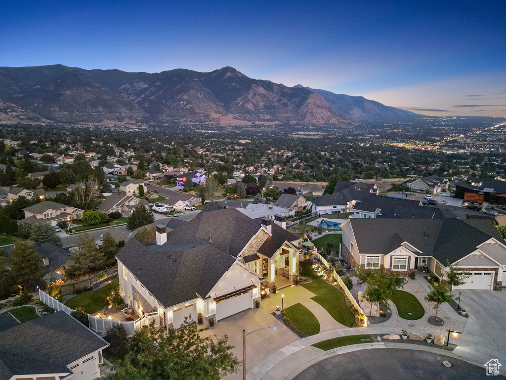 Aerial view at dusk featuring a mountain view