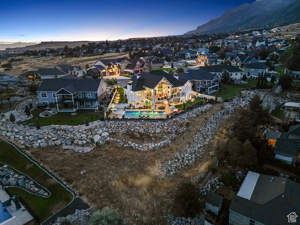 Aerial view at dusk featuring a mountain view