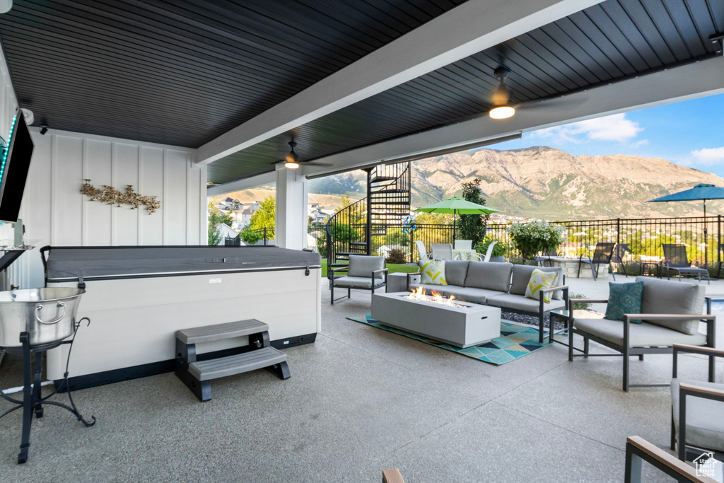 View of patio / terrace with a mountain view and an outdoor hangout area