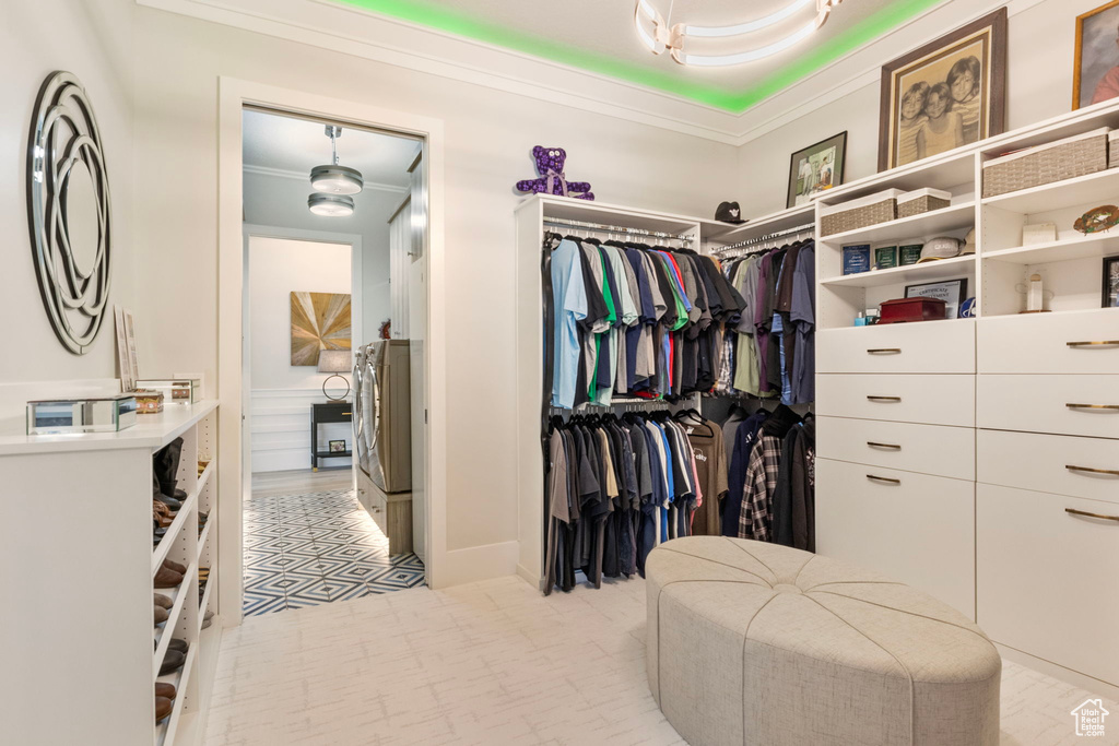 Spacious closet featuring light tile patterned floors