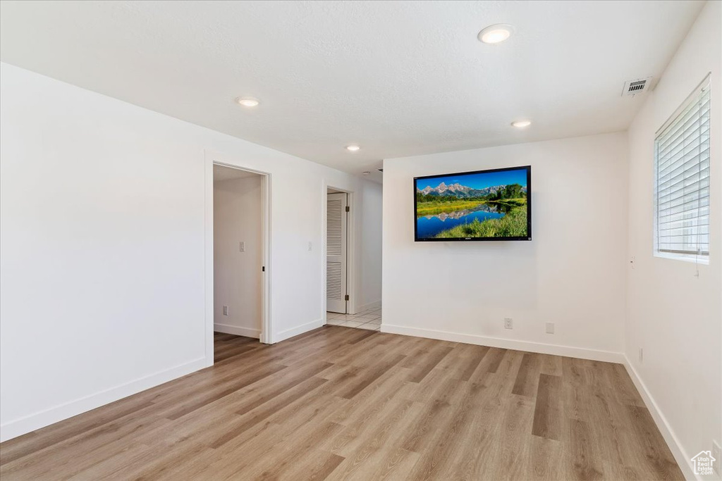 Empty room featuring light hardwood / wood-style flooring