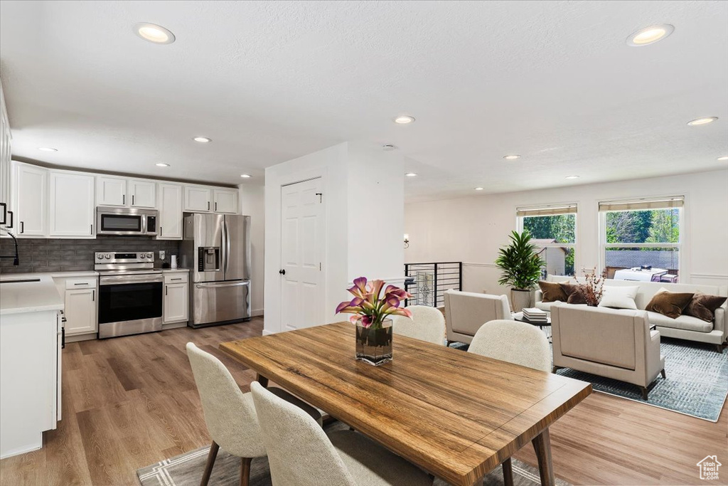 Dining space featuring light hardwood / wood-style flooring