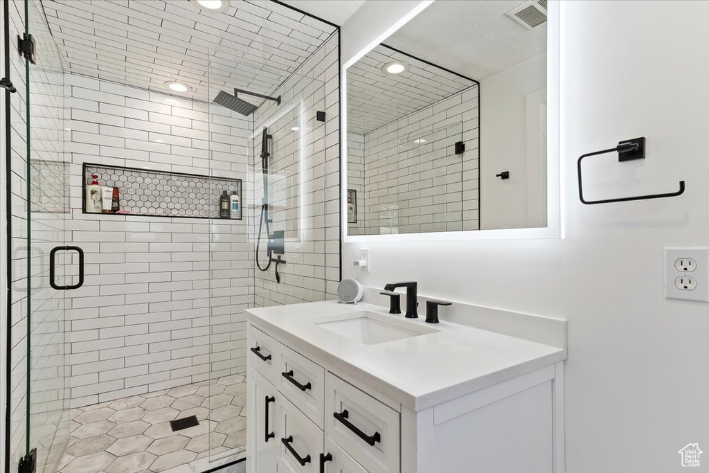 Bathroom with vanity and an enclosed shower