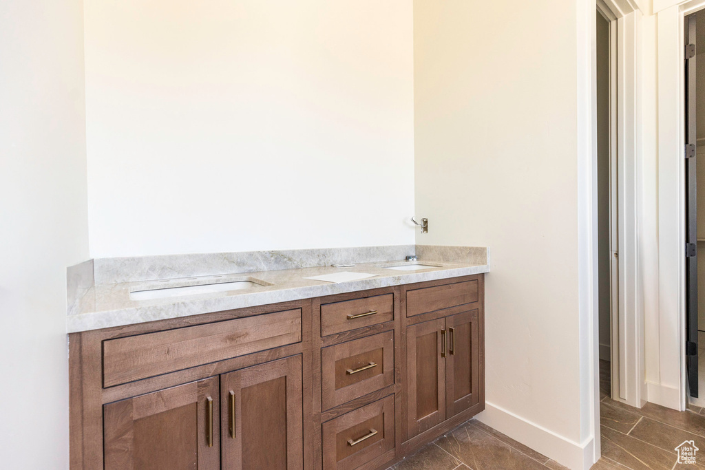 Bathroom with vanity and tile patterned flooring