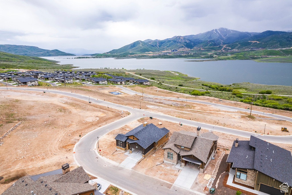 Aerial view featuring a water and mountain view