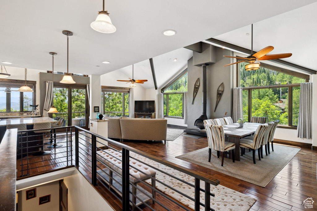 Dining area with ceiling fan and a wealth of natural light