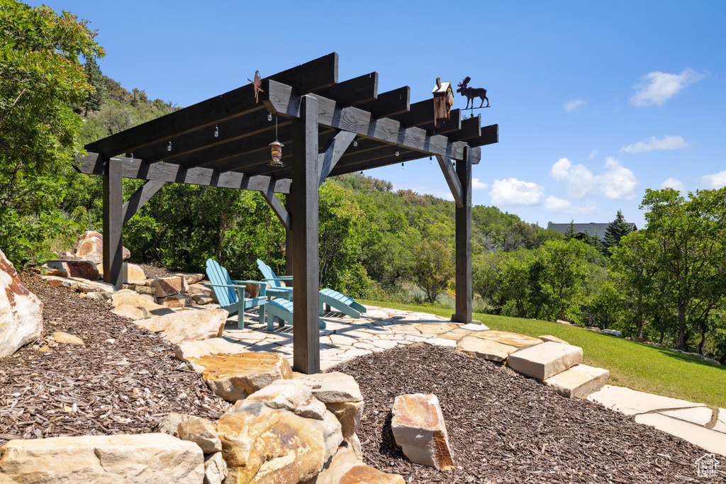 View of yard featuring a pergola and a patio area