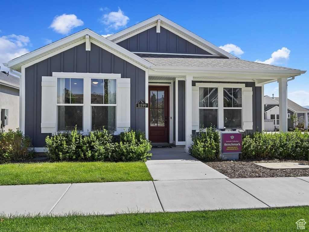 View of front of property with a front yard