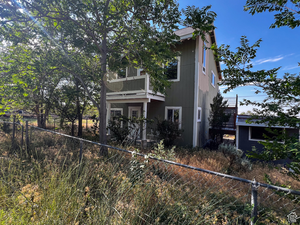 View of front of house with a balcony