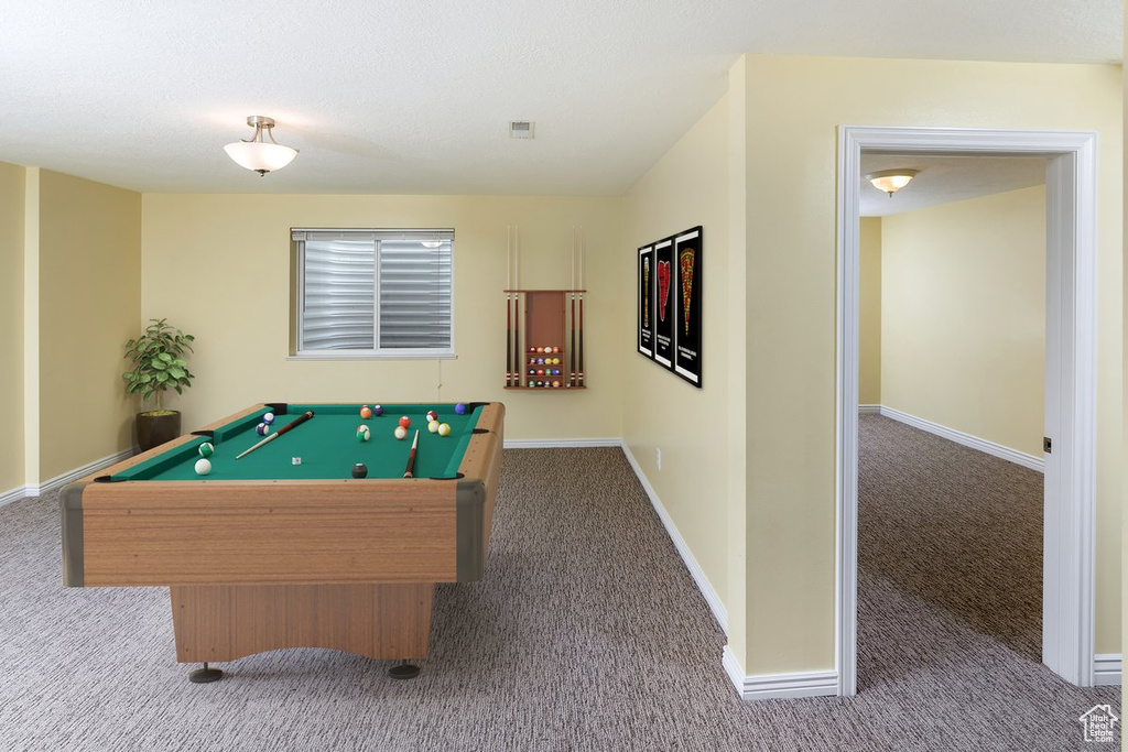 Recreation room with pool table and carpet floors