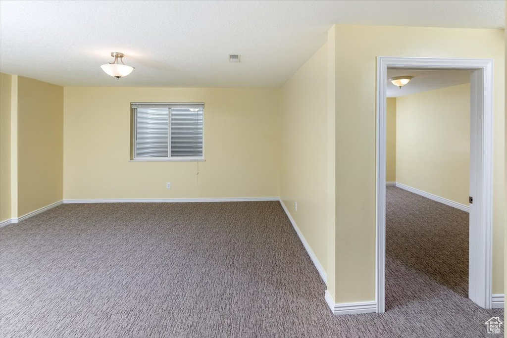 Empty room featuring carpet floors