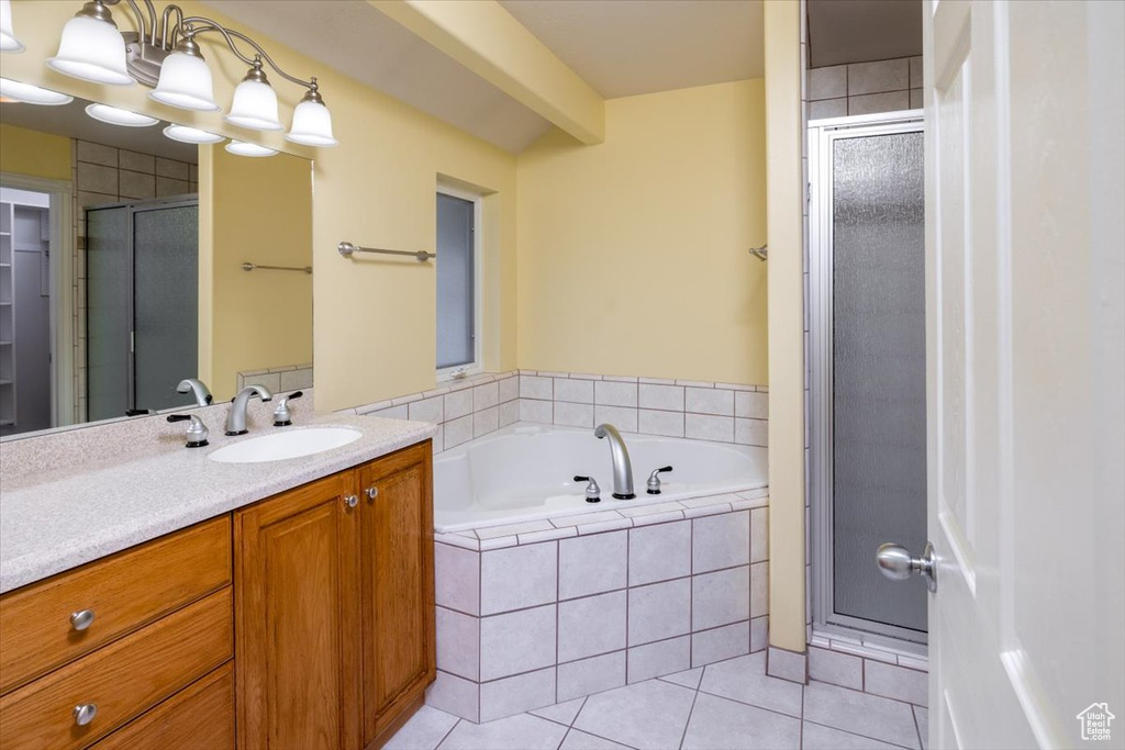 Bathroom with vanity, tile patterned flooring, and independent shower and bath