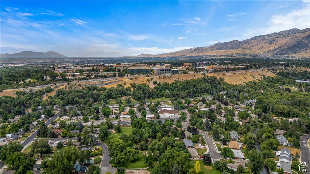 Birds eye view of property with a mountain view