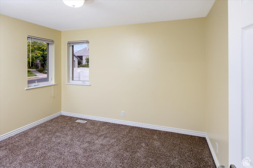 Empty room featuring carpet flooring