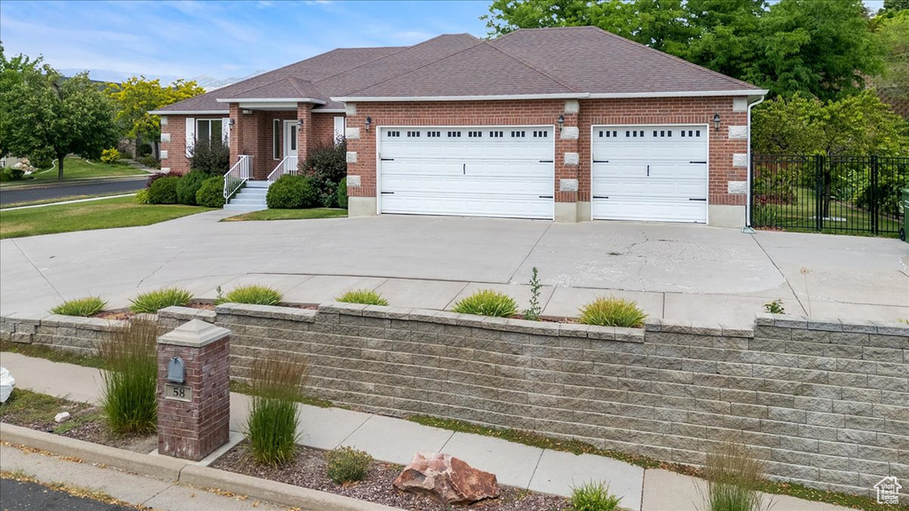 View of front of property featuring a garage