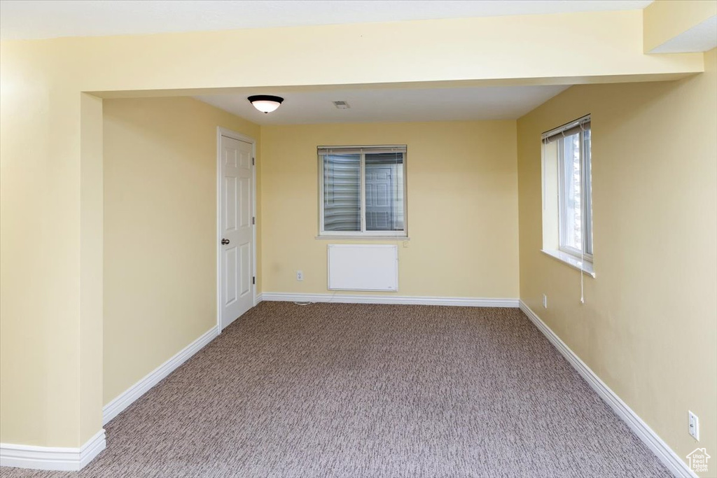 Unfurnished room with carpet flooring