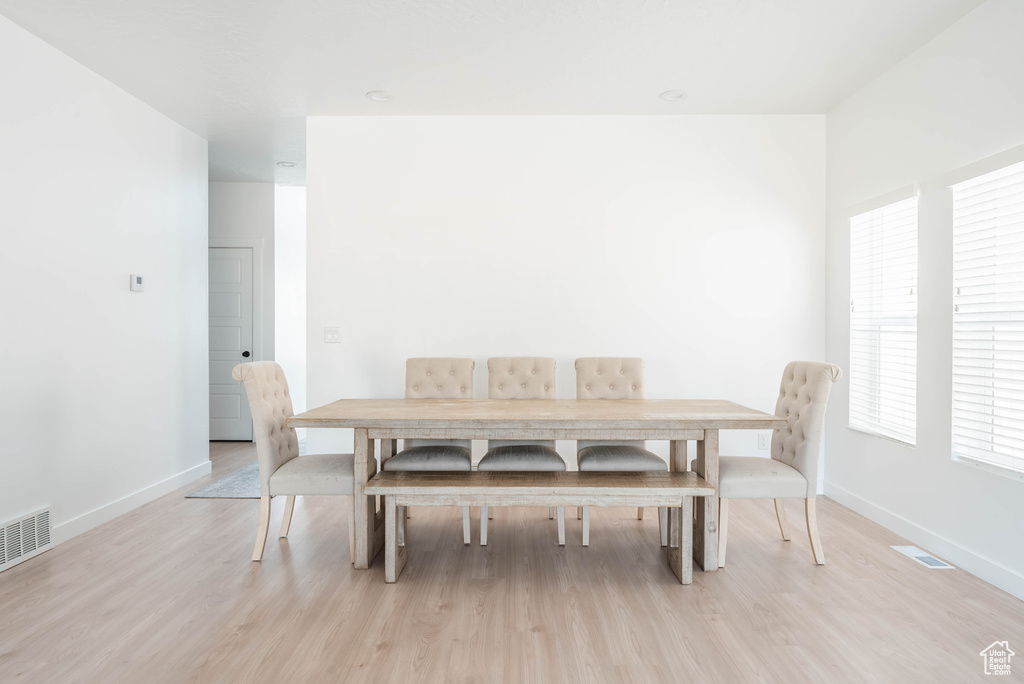 Dining area featuring light wood-type flooring