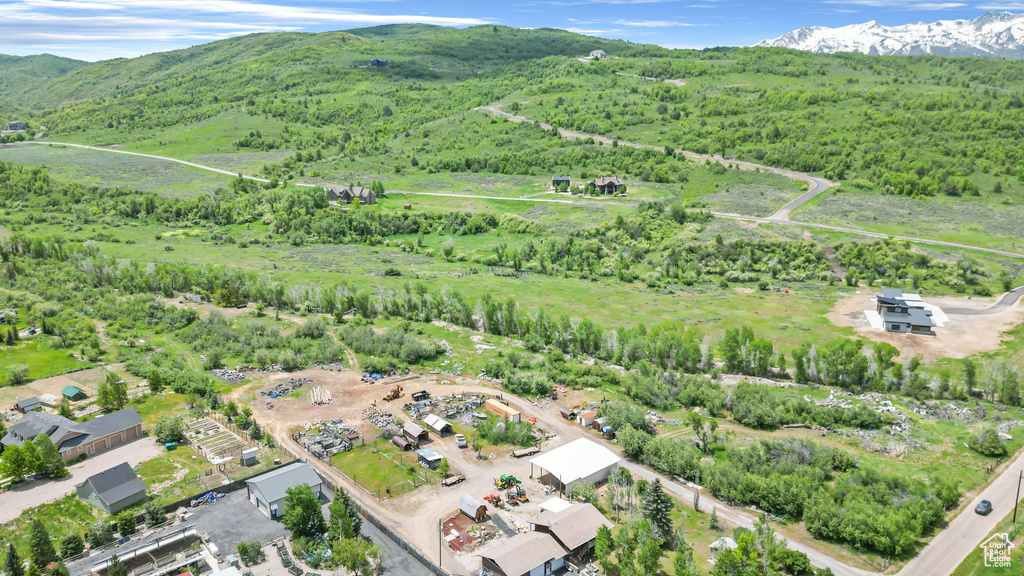 Birds eye view of property featuring a mountain view