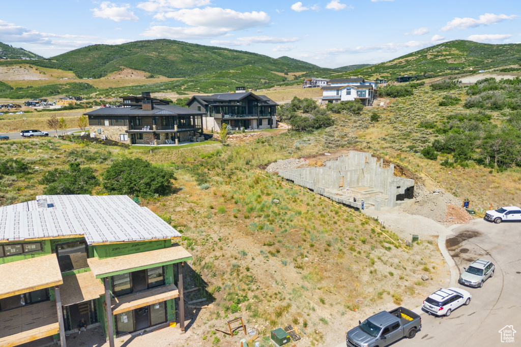 Birds eye view of property with a mountain view