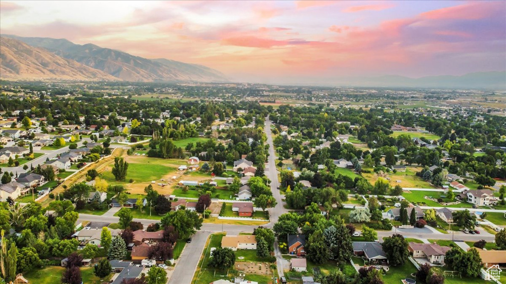 Aerial view at dusk featuring a mountain view