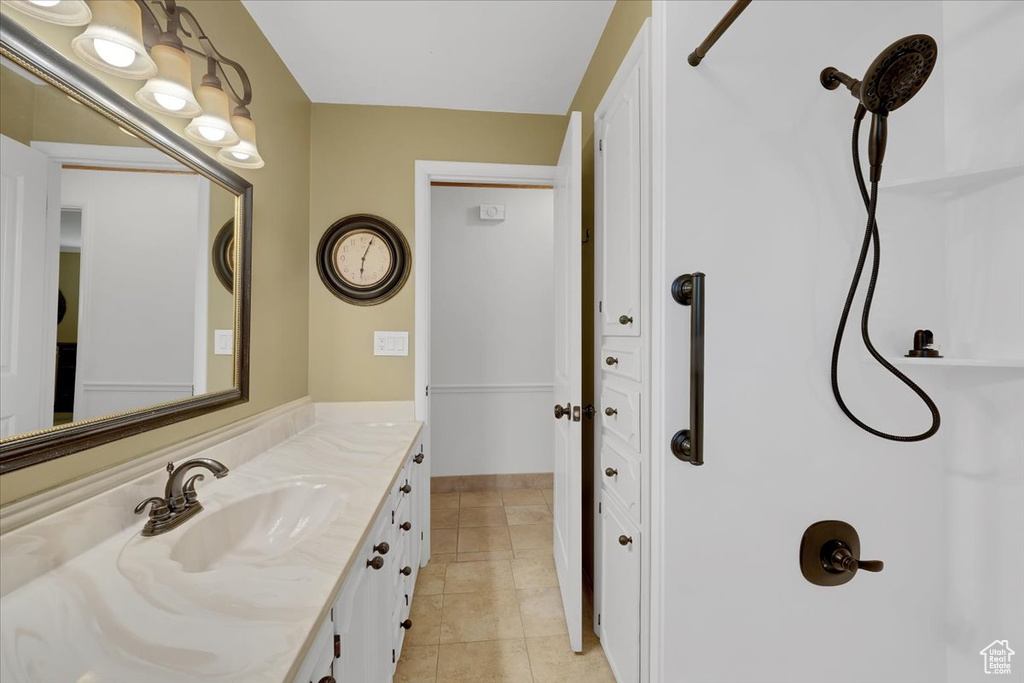 Bathroom featuring vanity and tile patterned floors