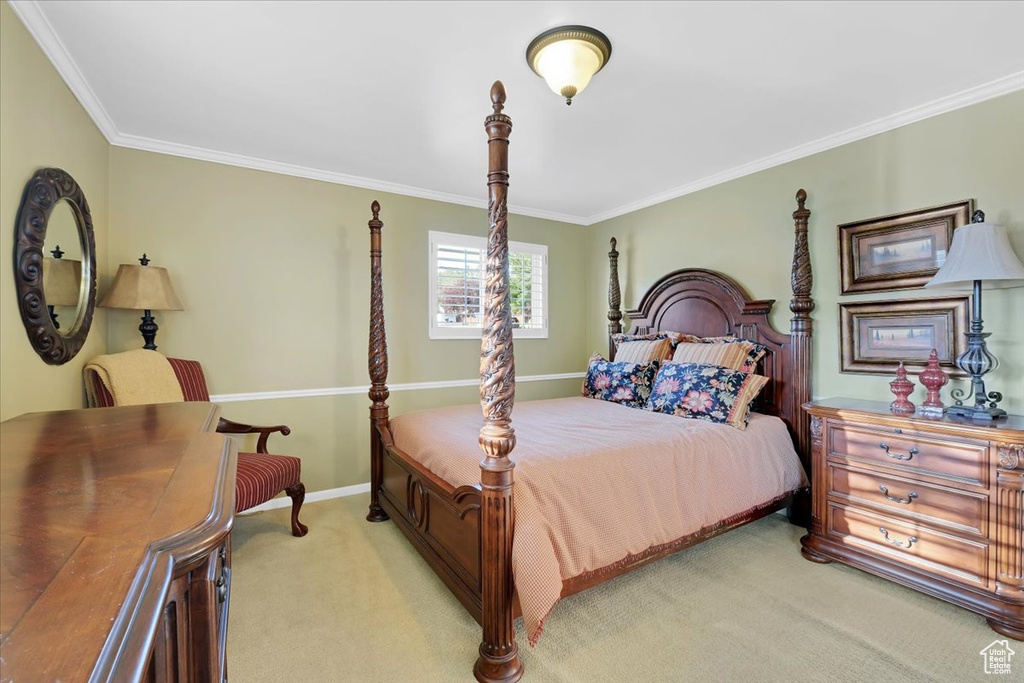 Bedroom with carpet floors and ornamental molding