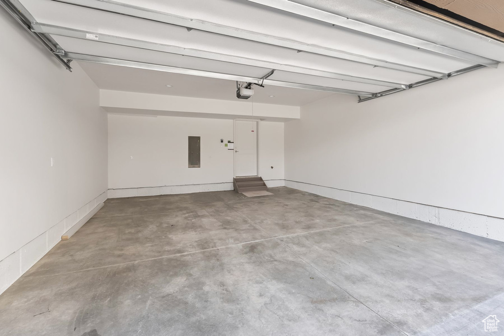 Garage with a garage door opener and electric panel