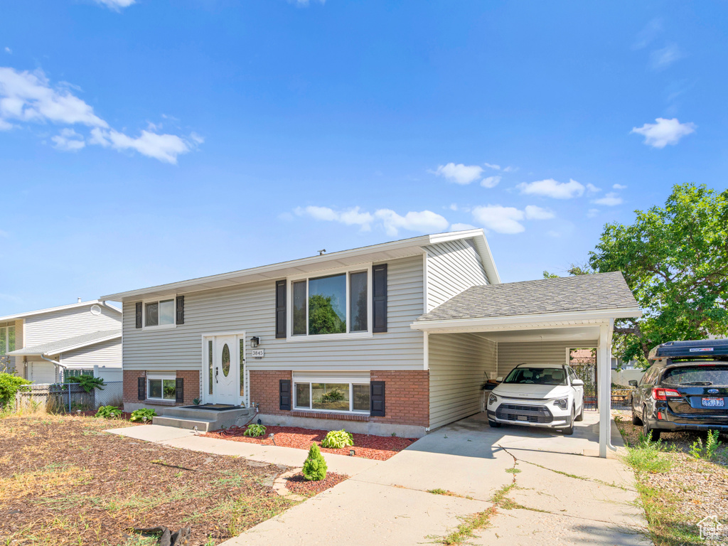 Split foyer home with a carport