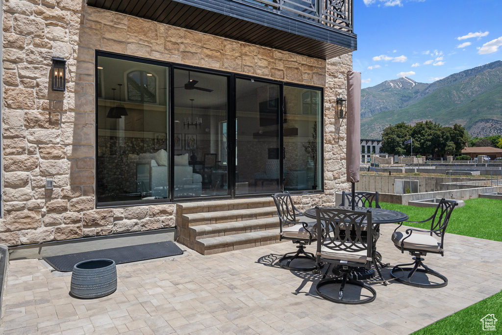 View of patio featuring a mountain view and a balcony