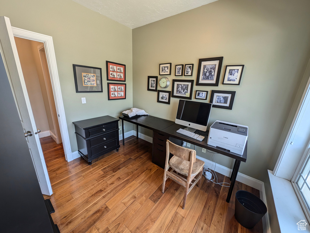 Office with hardwood / wood-style floors