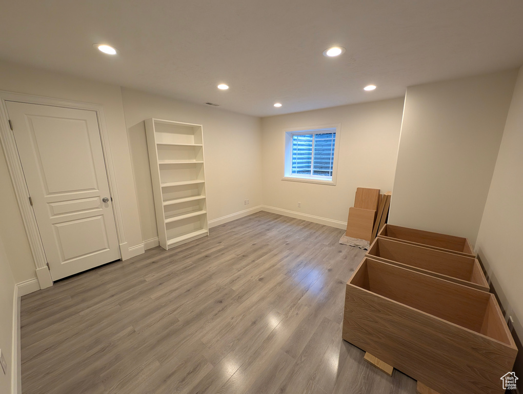 Unfurnished bedroom featuring hardwood / wood-style floors