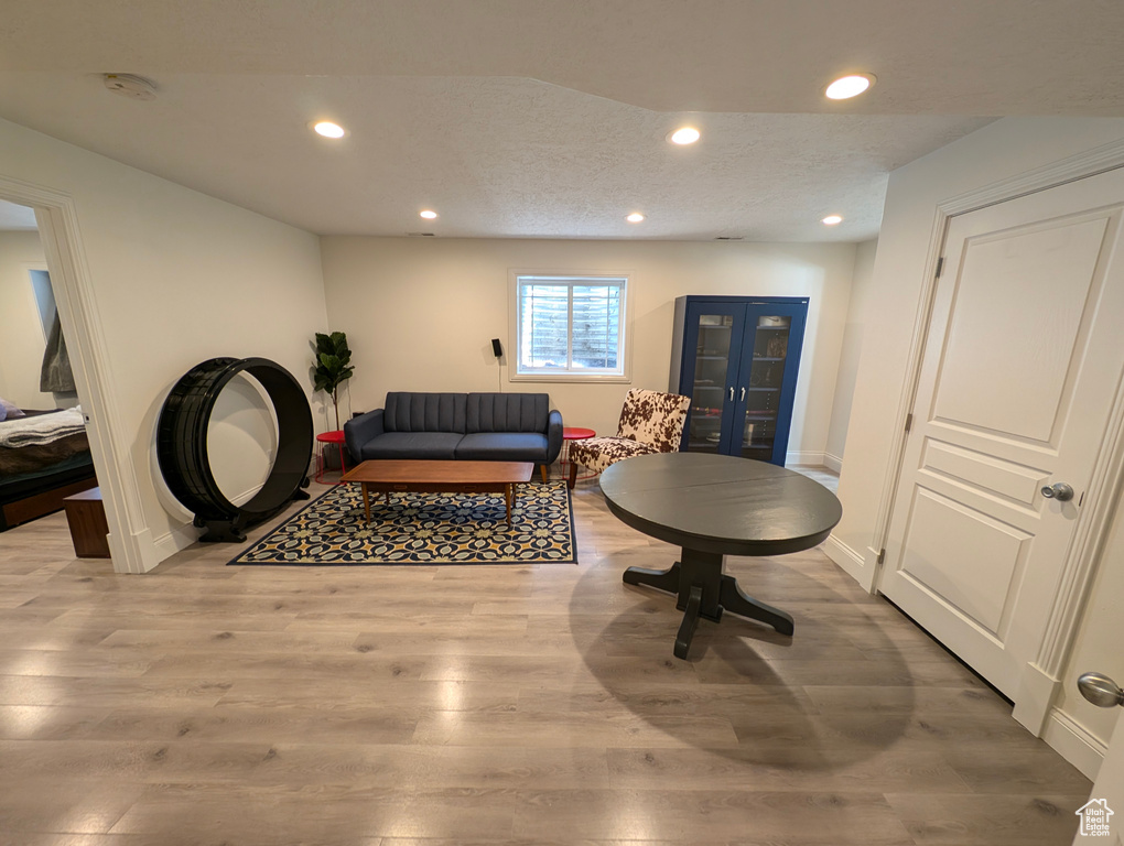 Interior space featuring light hardwood / wood-style flooring and a textured ceiling