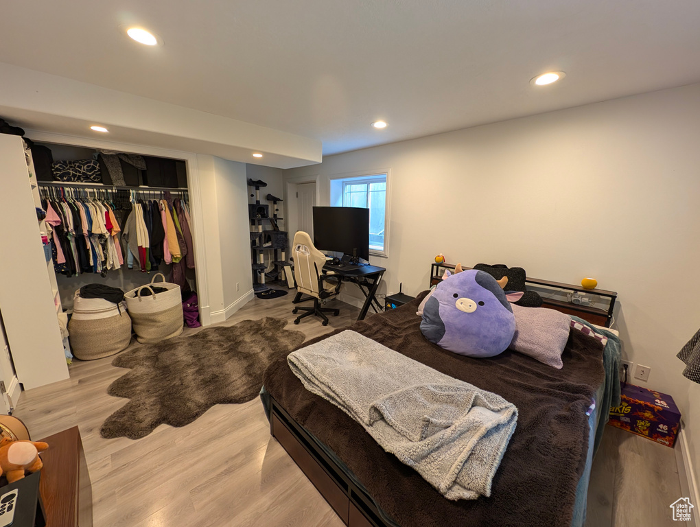 Bedroom featuring a closet and light wood-type flooring