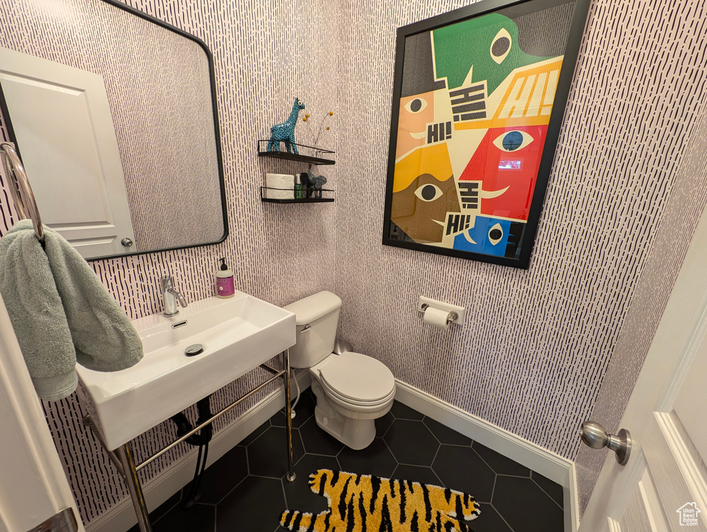 Bathroom with tile patterned flooring and toilet