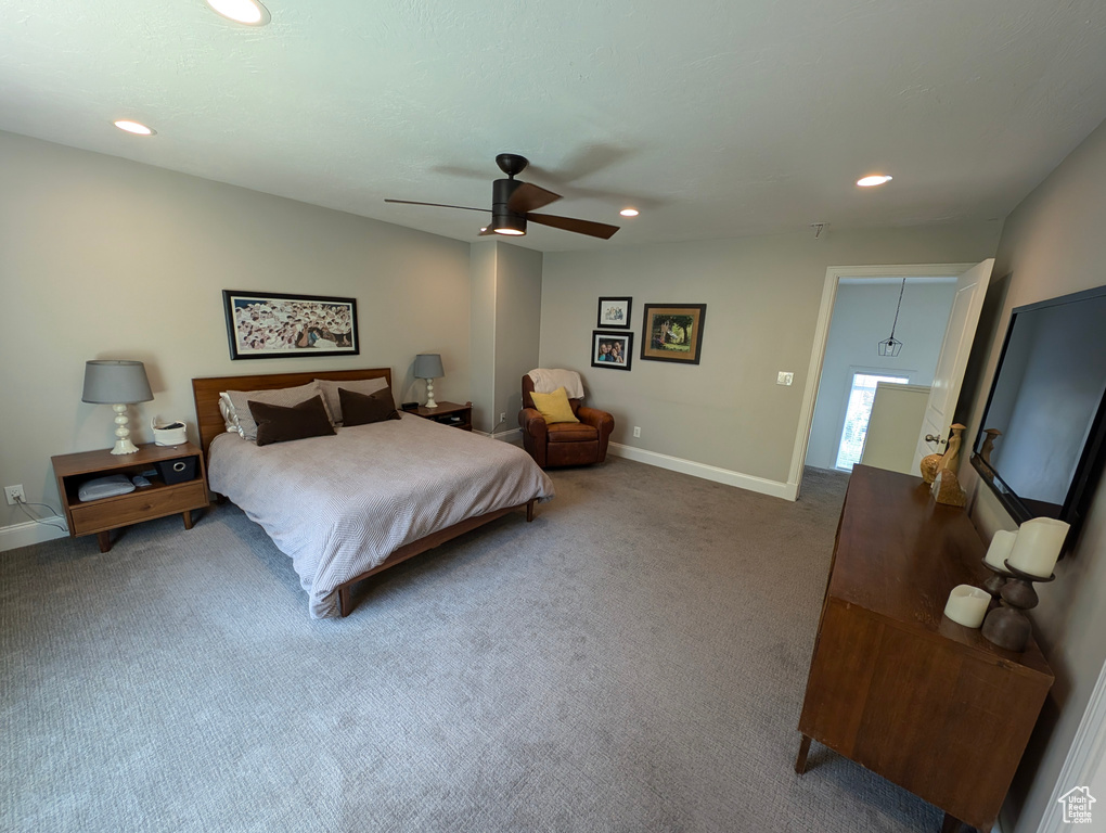 Carpeted bedroom with ceiling fan