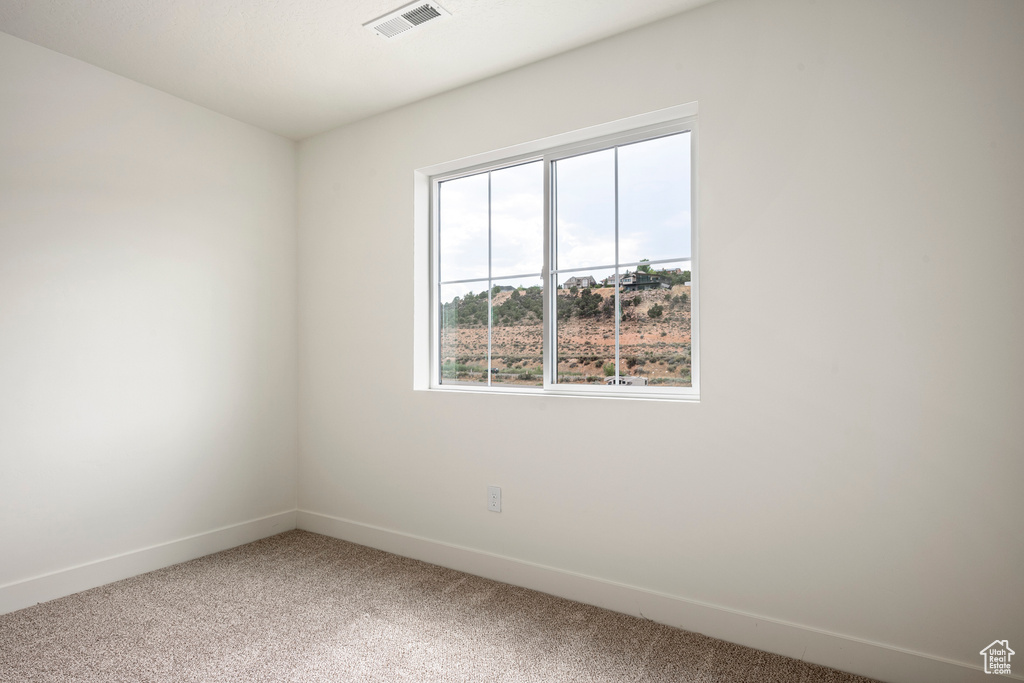 View of carpeted spare room