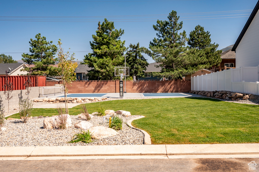 View of yard with a fenced in pool