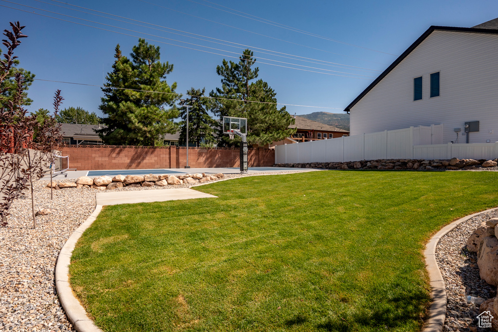 View of yard featuring a covered pool