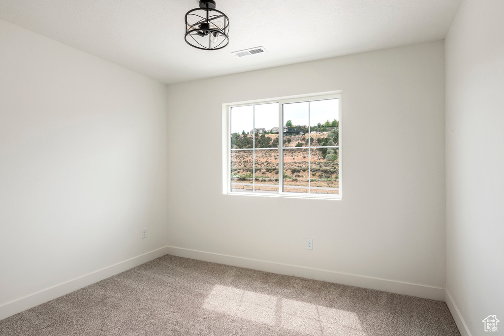 Empty room with carpet floors