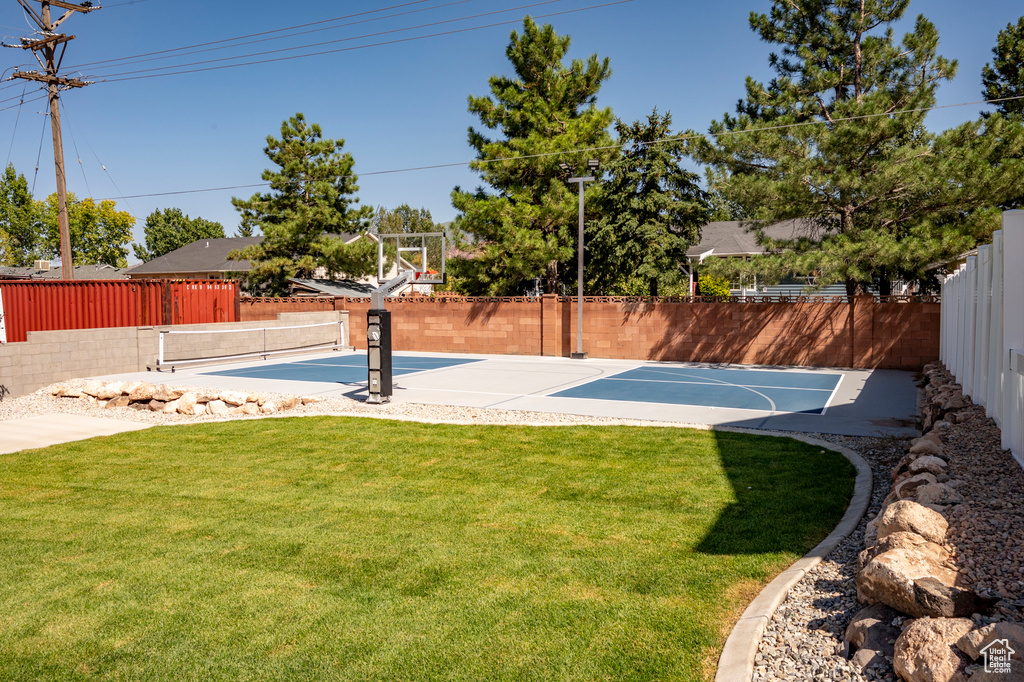 View of yard featuring basketball court