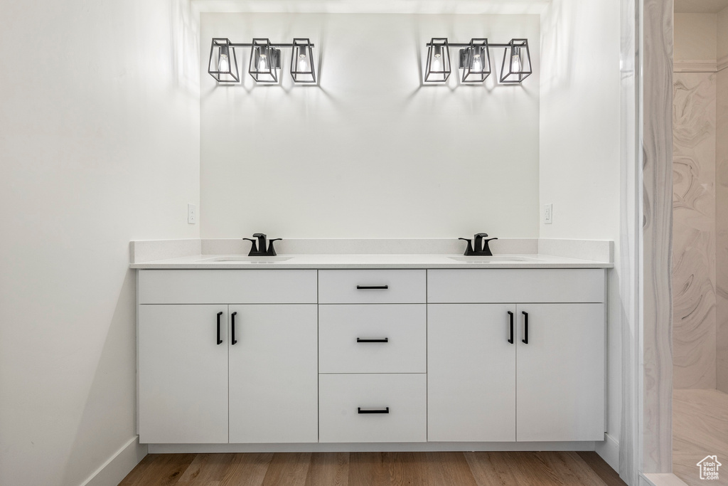 Bathroom featuring sink and hardwood / wood-style flooring