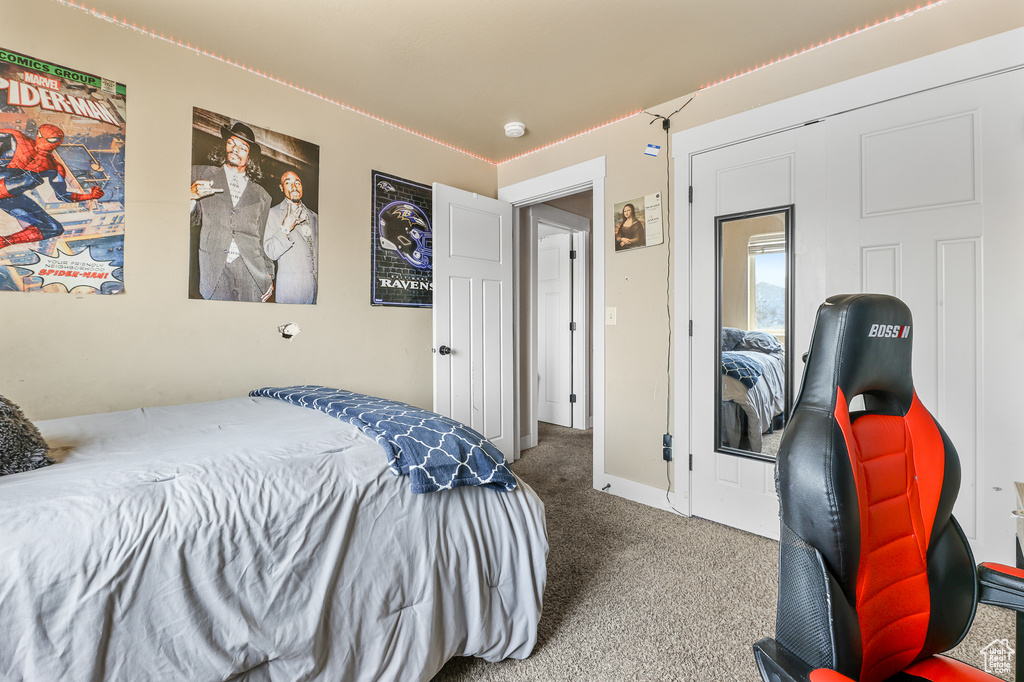 Bedroom with a closet and carpet flooring