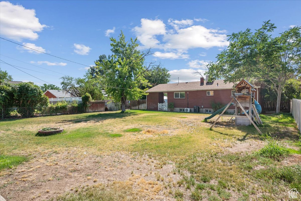 View of yard featuring a playground