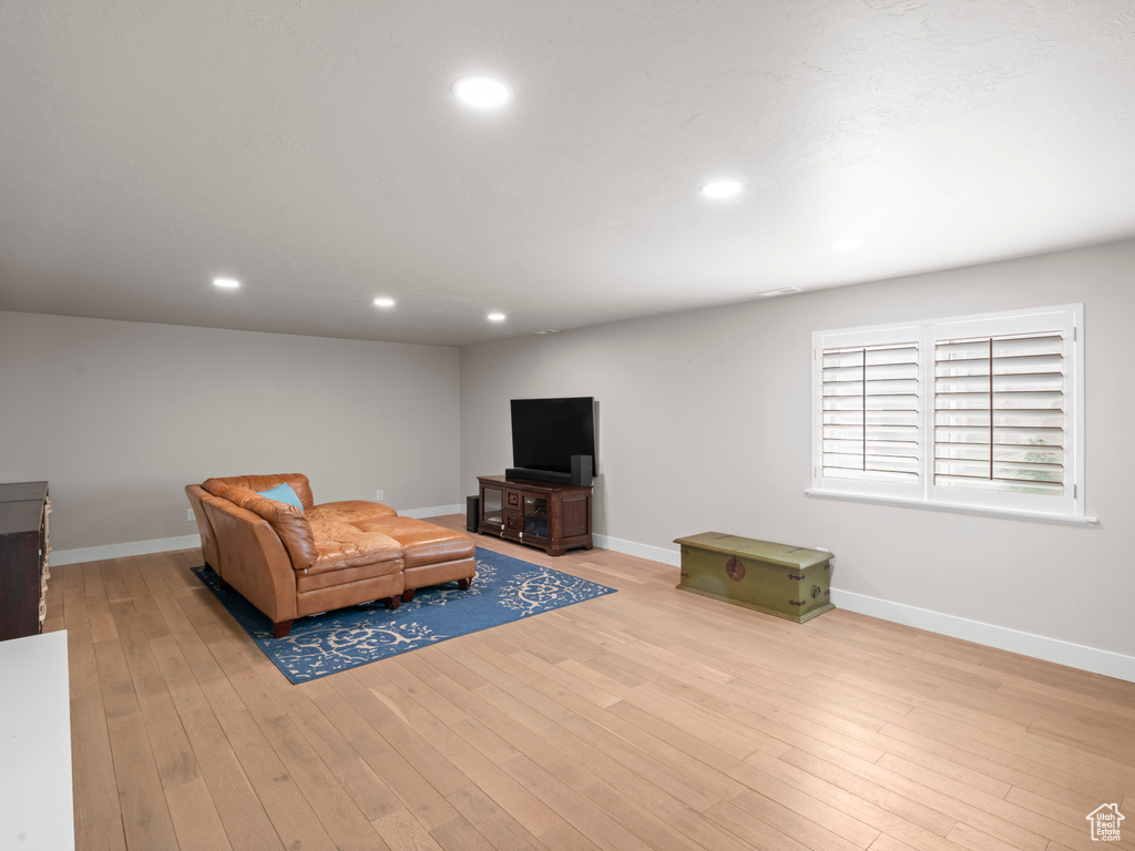 Living room with light hardwood / wood-style flooring