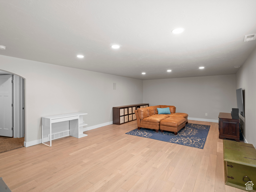 Living room with light hardwood / wood-style flooring