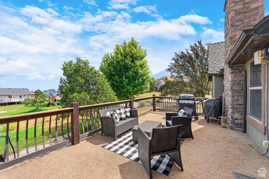 View of patio featuring area for grilling and an outdoor hangout area