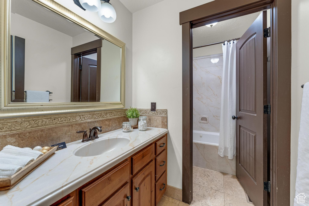 Bathroom featuring vanity and tile patterned flooring