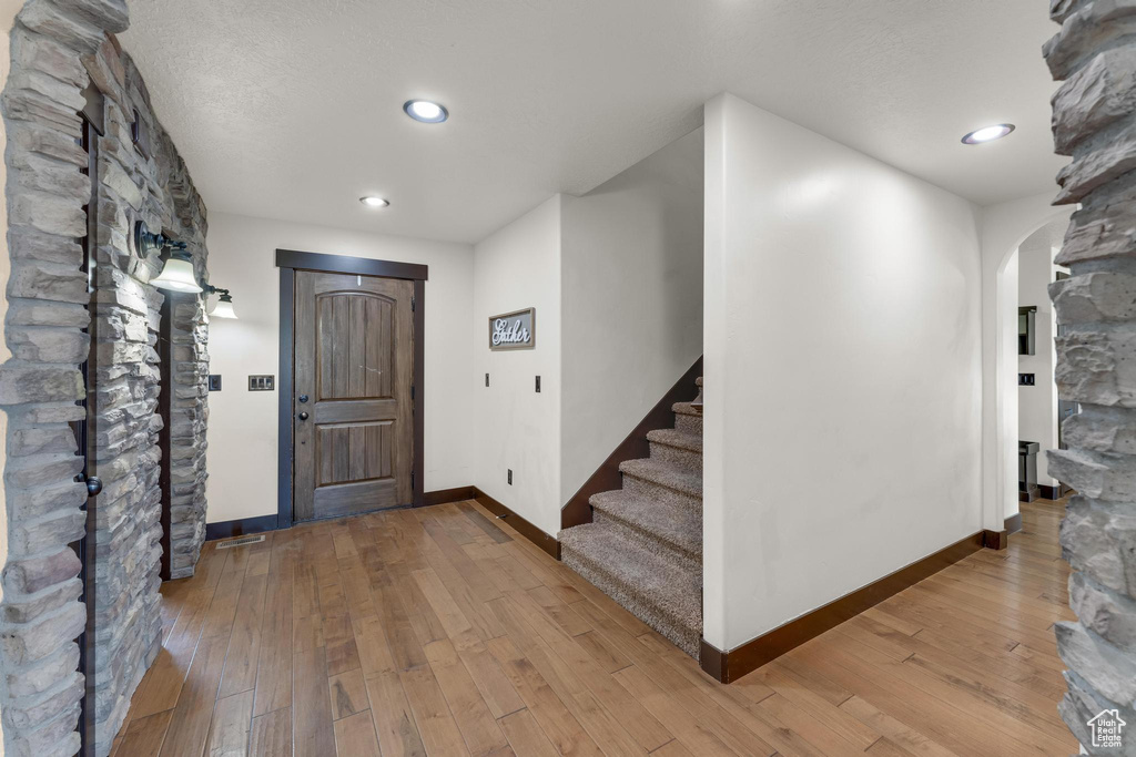 Foyer with hardwood / wood-style floors