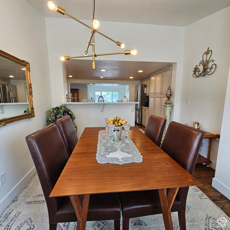 Dining room featuring sink and dark hardwood / wood-style flooring